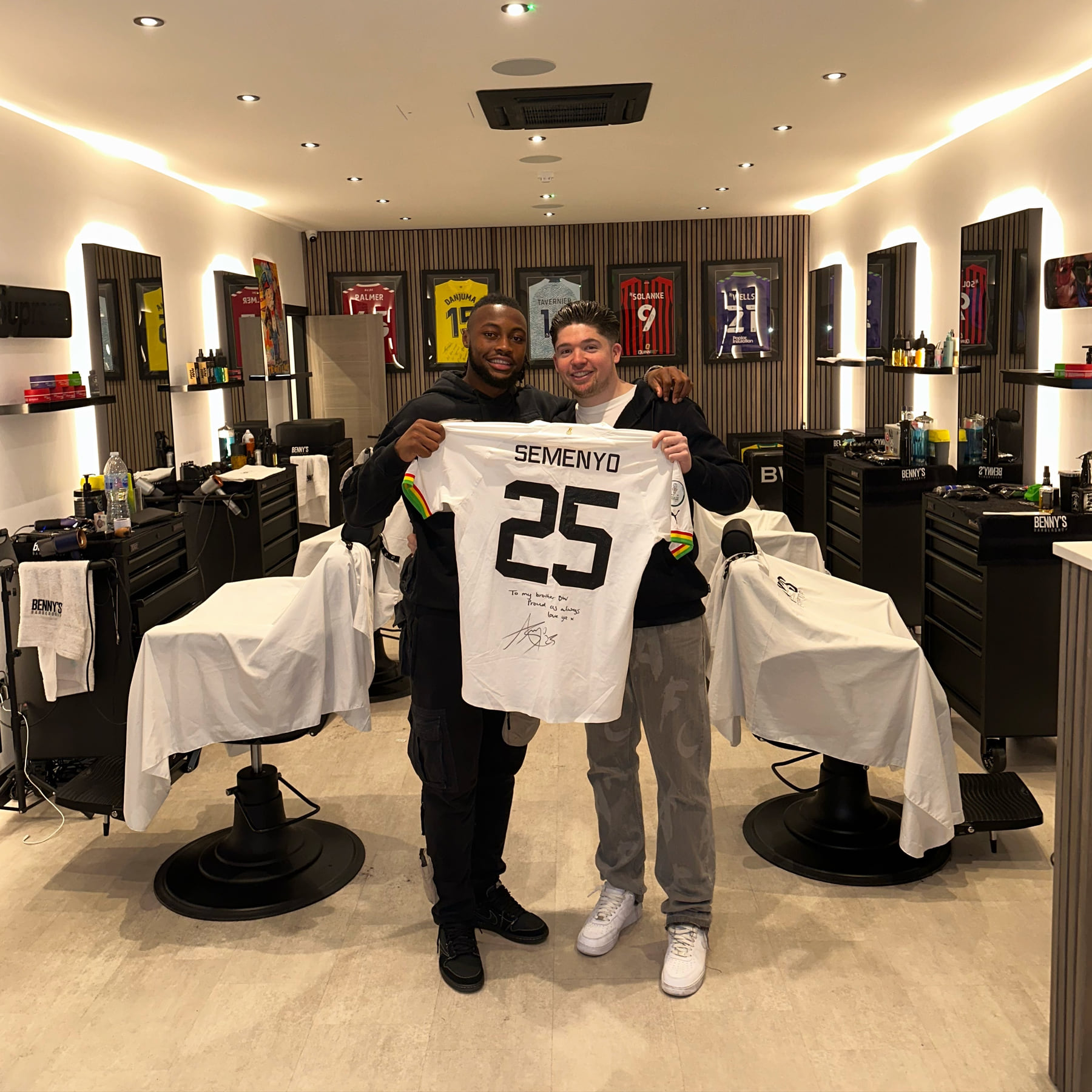 Inside Benny's on Devizes Road: the chairs, and signed football shirts on the wall