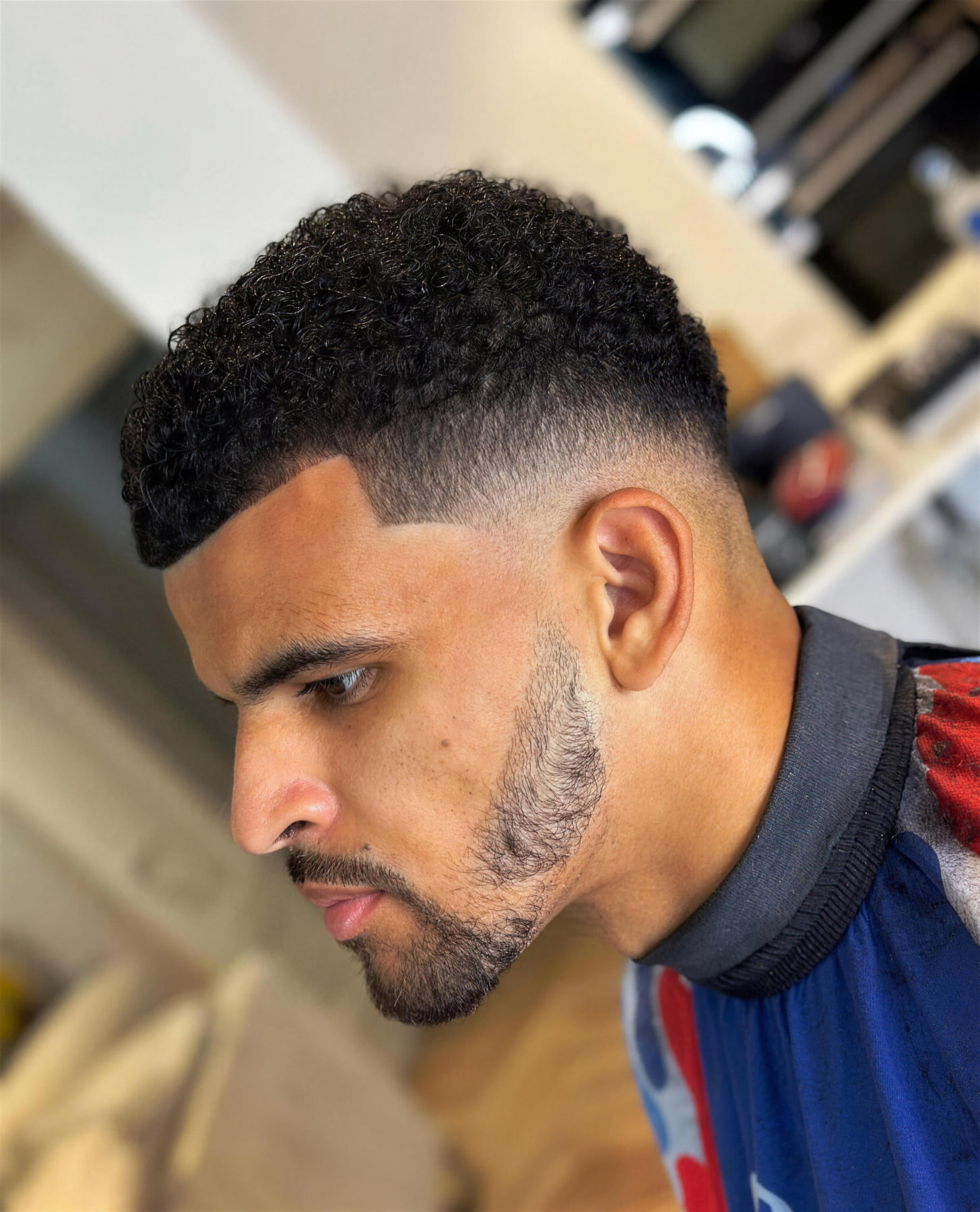 A footballer at Benny's Barbershop